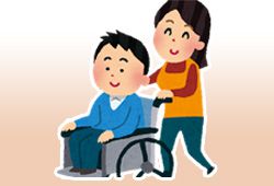 車椅子を押す人